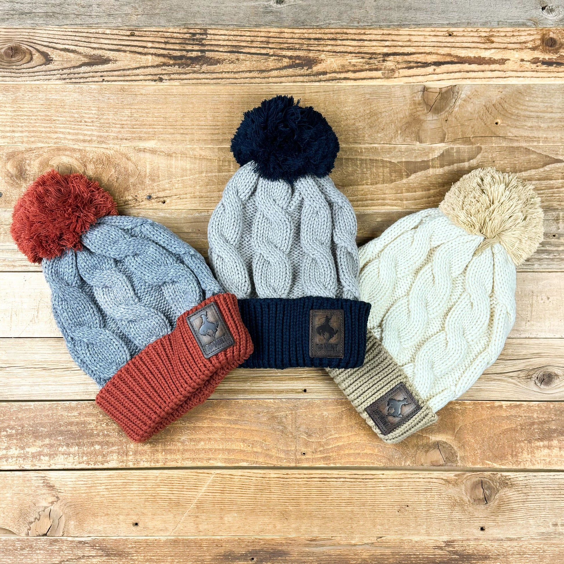 Leather Patch Cable Knit Pom Beanies Colors! – THE MINT BAR WYO